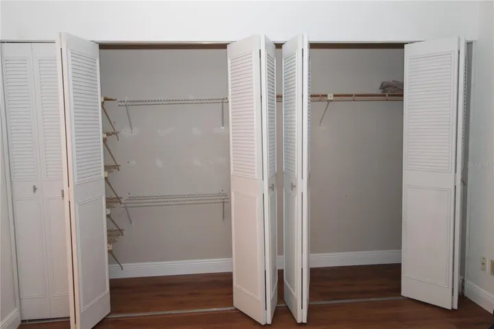 Large wall to wall reach in closet provides plenty of storage space in the bedroom.