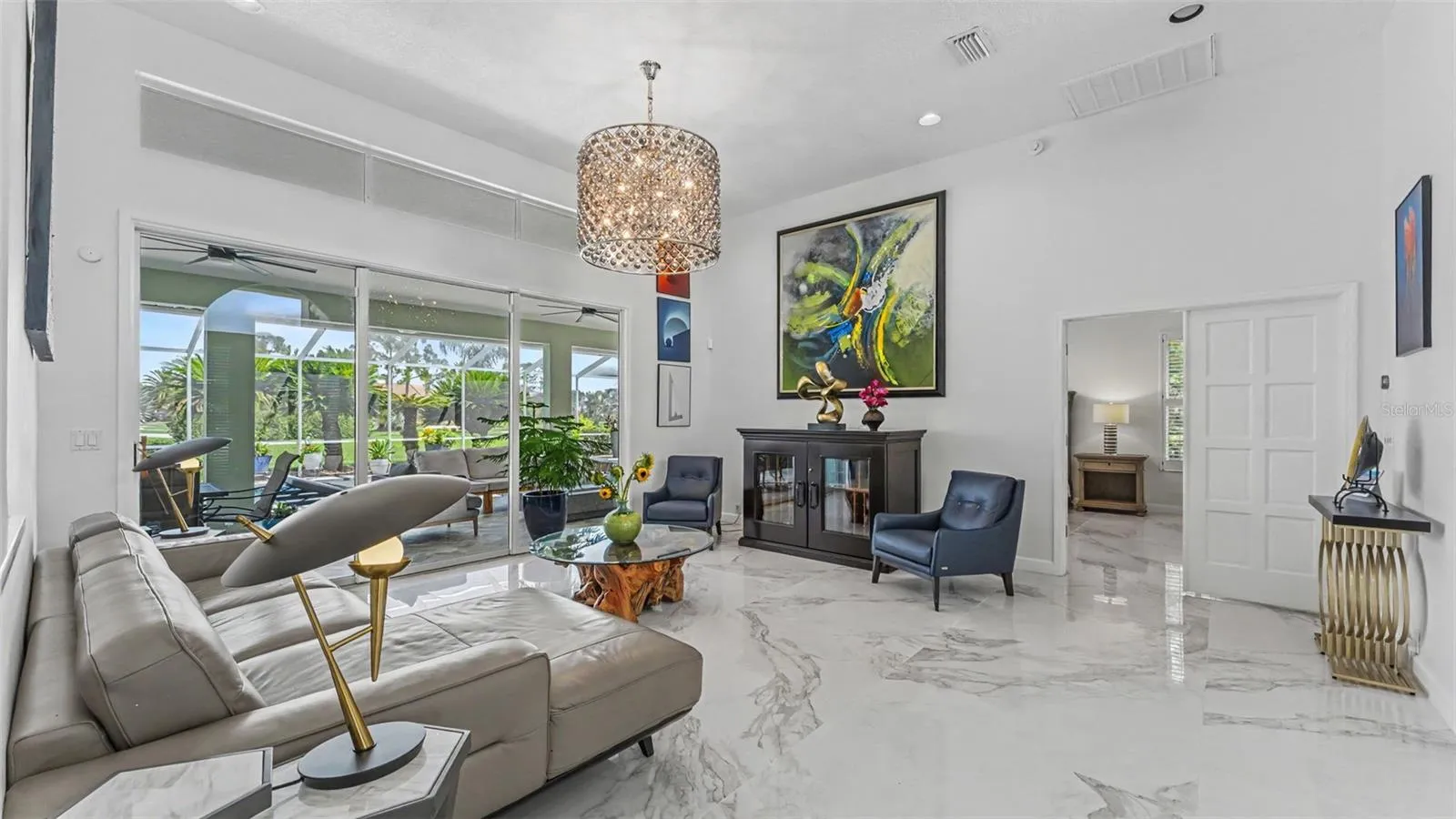 Living Room with sliders leading out to lanai - perfect for parties!
