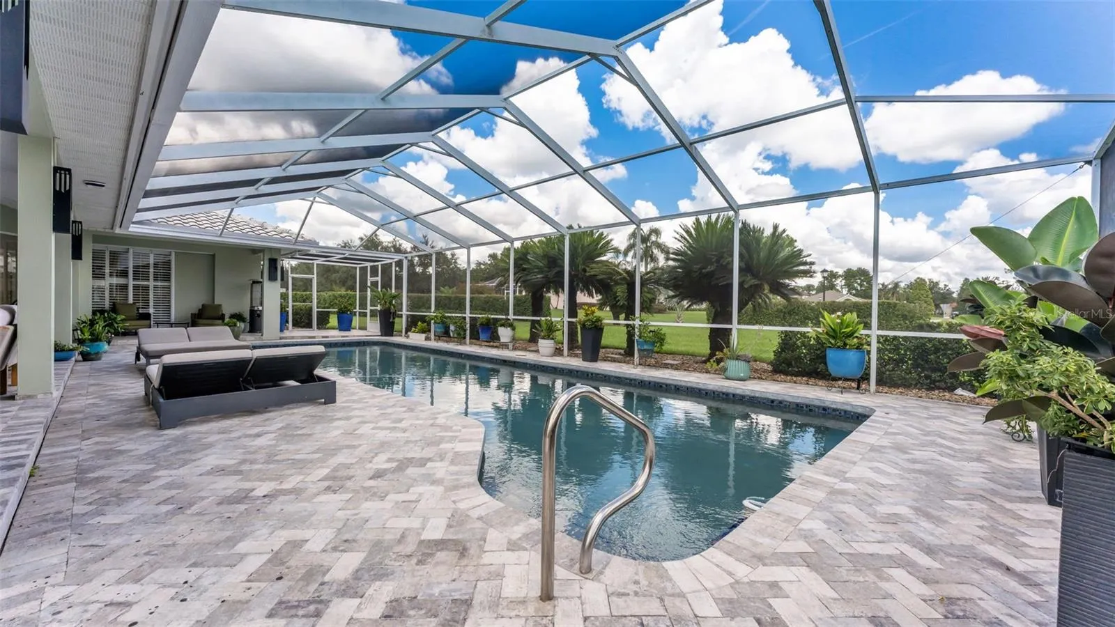 Updated pavered lanai and saltwater pool - perfect for enjoying the Florida lifestyle!