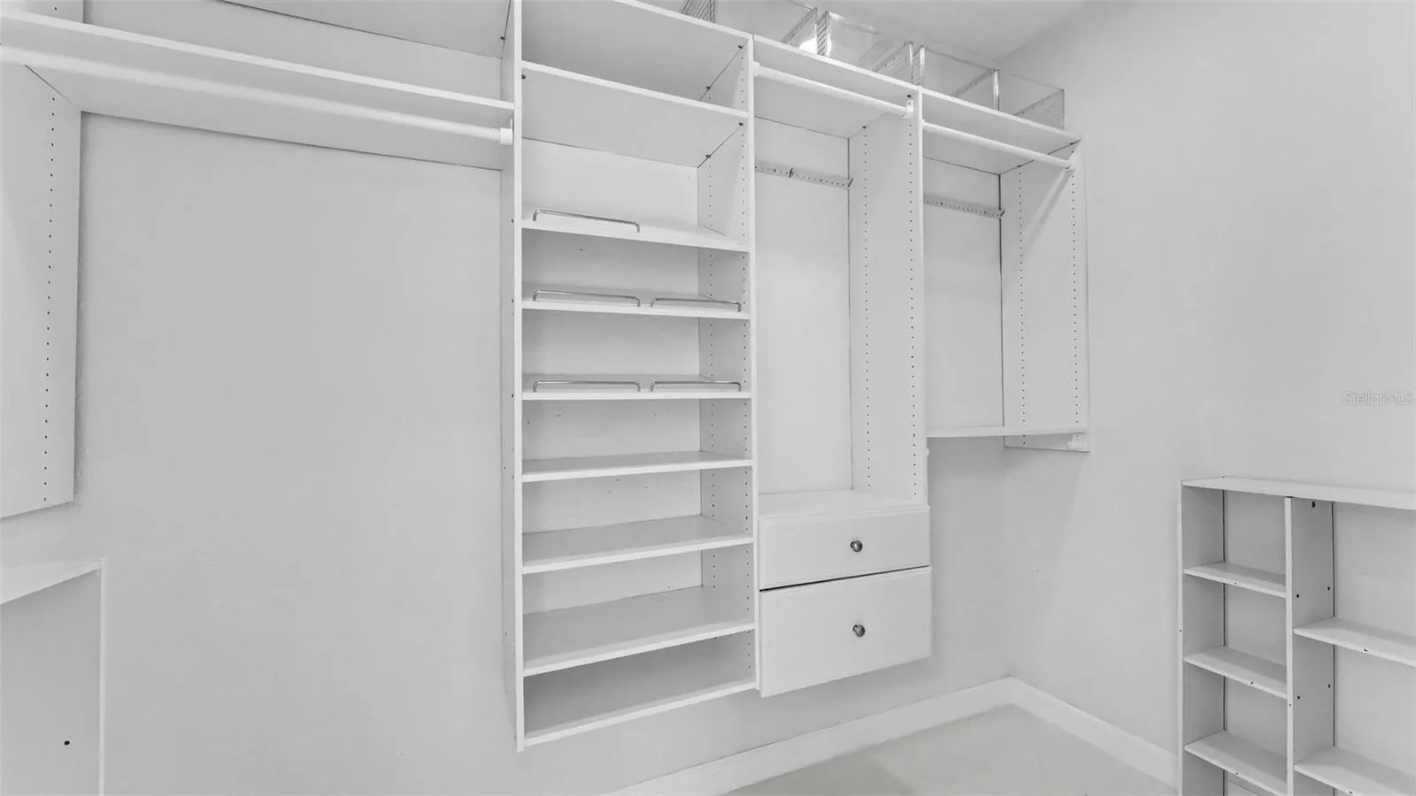 Primary Suite Walk in closet with built ins