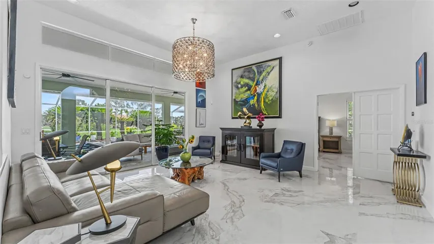 Living Room with sliders leading out to lanai - perfect for parties!