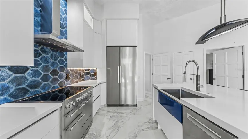 Kitchen with oversized kitchen island offering plenty of prep work space