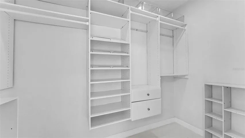 Primary Suite Walk in closet with built ins