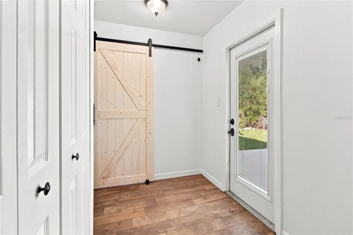 laundry room behind barn door