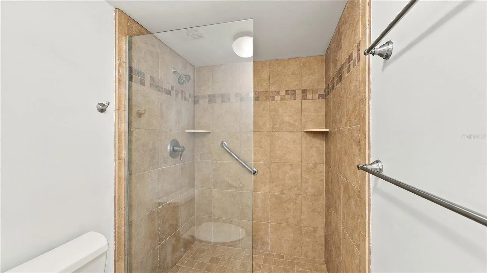 Primary Shower with walk in and Glass Wall