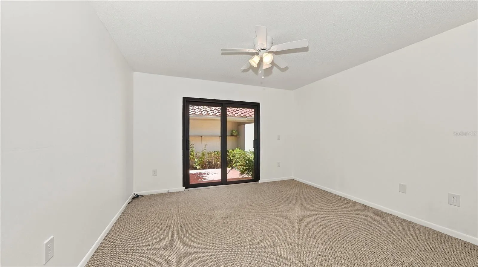 2nd Bedroom at the front of the house with porch.