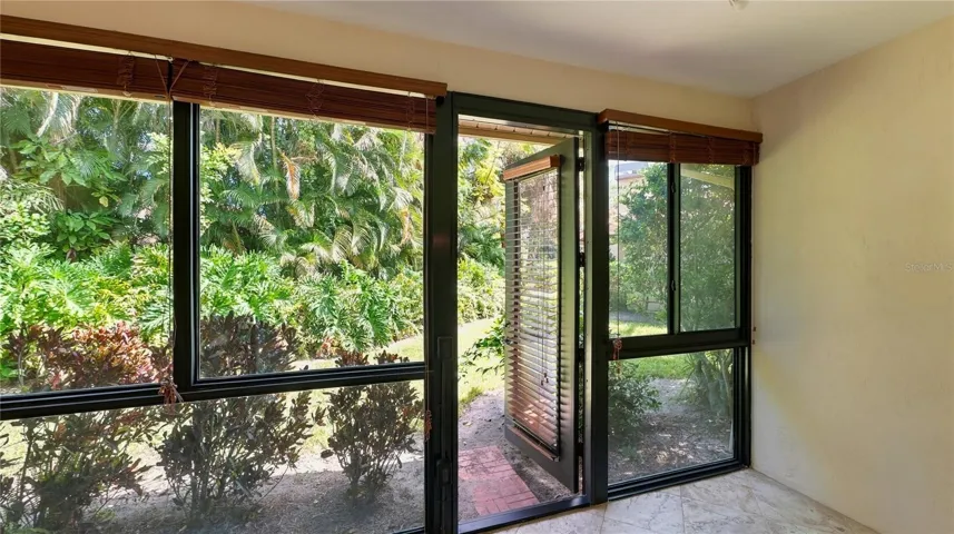 Sun Room with door to backyard.
