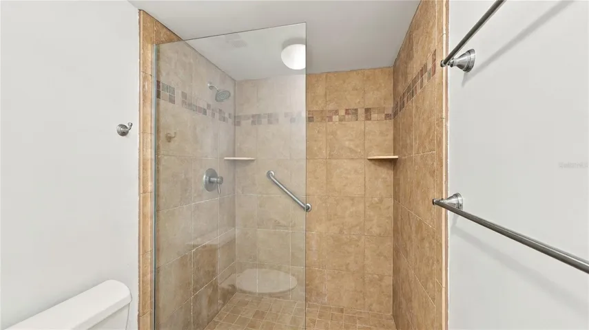 Primary Shower with walk in and Glass Wall