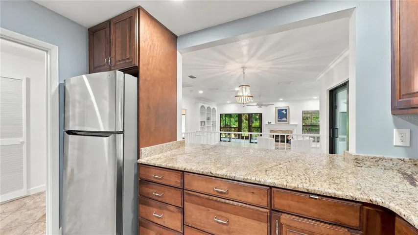Kitchen - View of Dining Room and Living Room