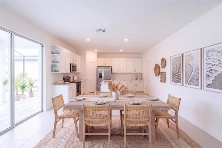 Virtually staged dining room and Kitchen