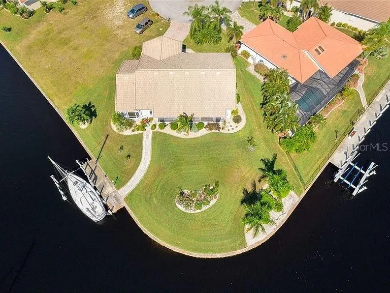Seller provided photo with seawall in tact.