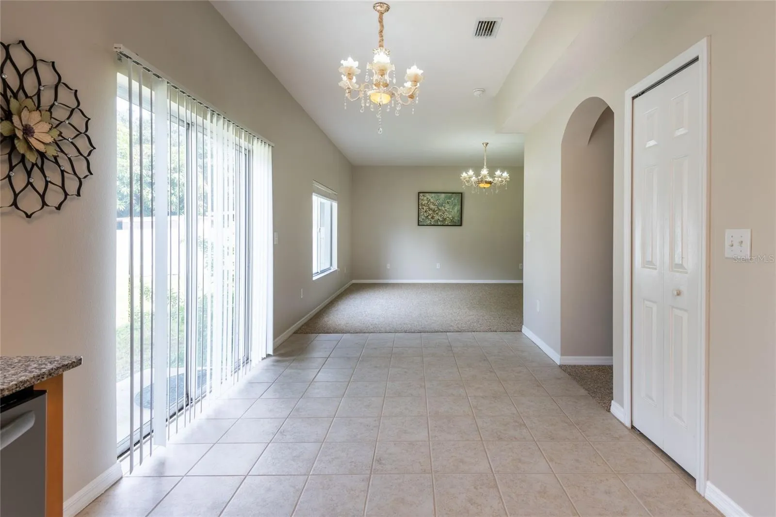 Kitchen opens seamlessly to the family room with easy access to the backyard
