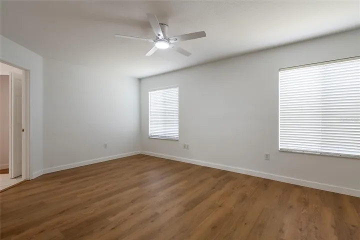 The primary bedroom features new flooring.