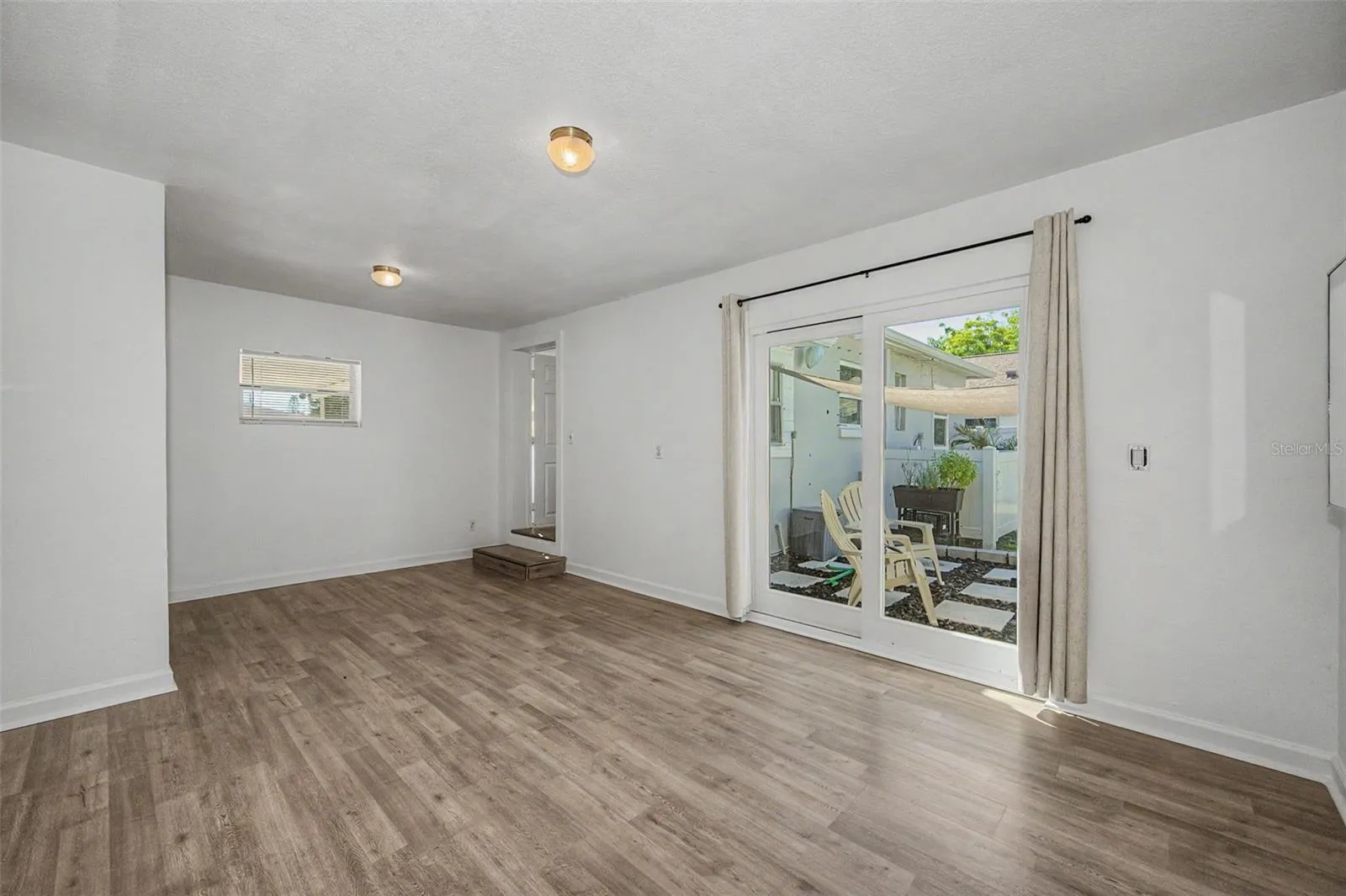 Primary Bedroom with Slider to Out Back