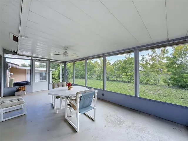 Spacious screened-in lanai, perfect for relaxing and enjoying the outdoors in comfort.