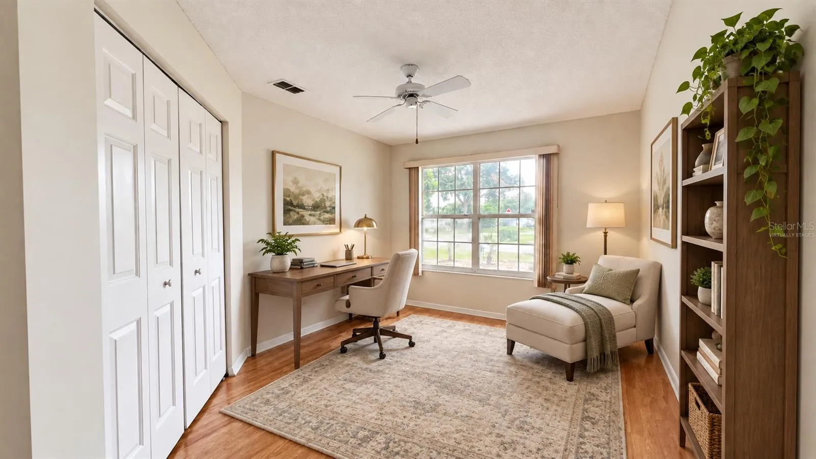1 of 3 total bedrooms, this one features double door entry. Virtually staged as a home office/library.