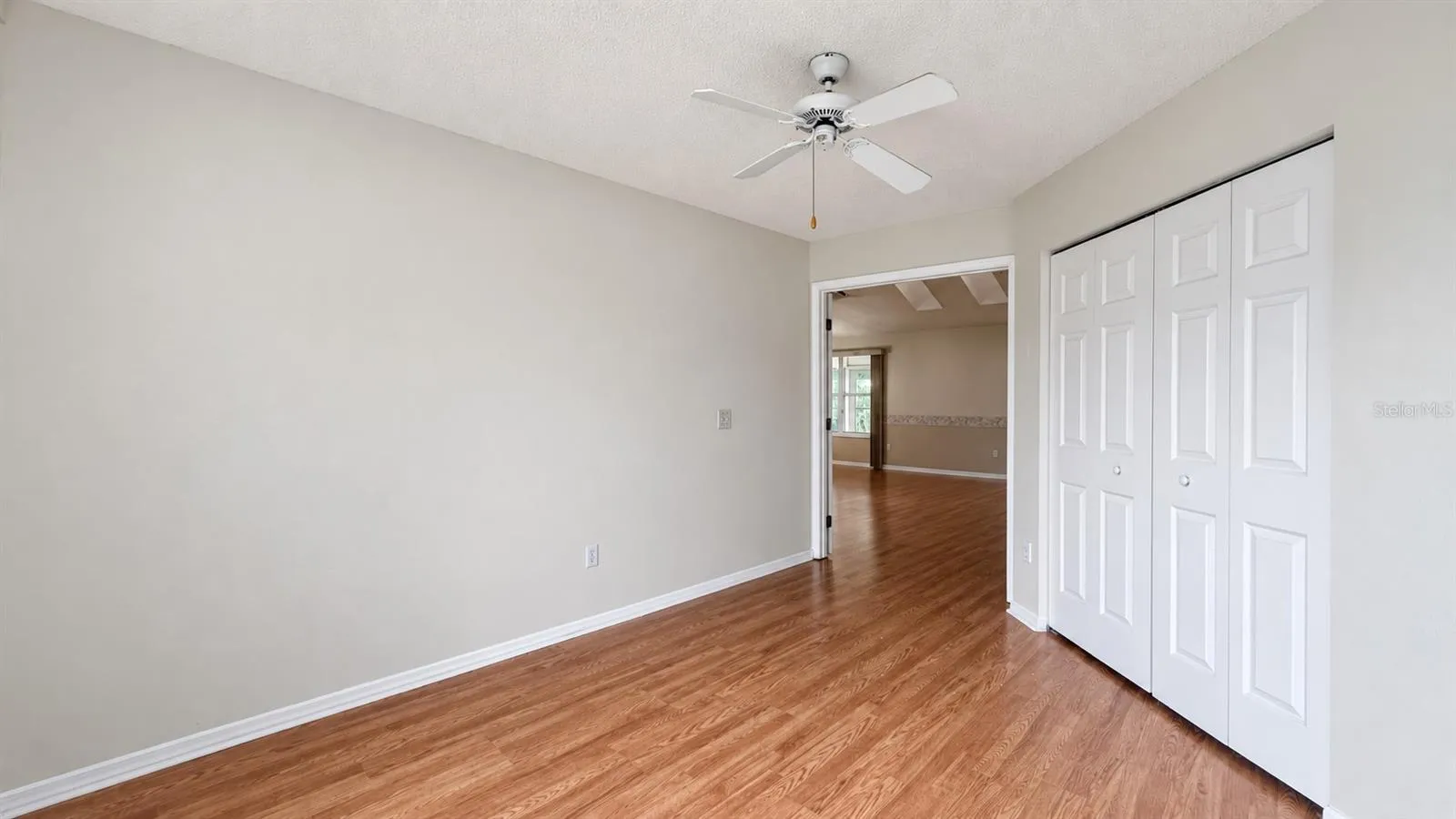 1 of 3 total bedrooms, this one features double door entry.