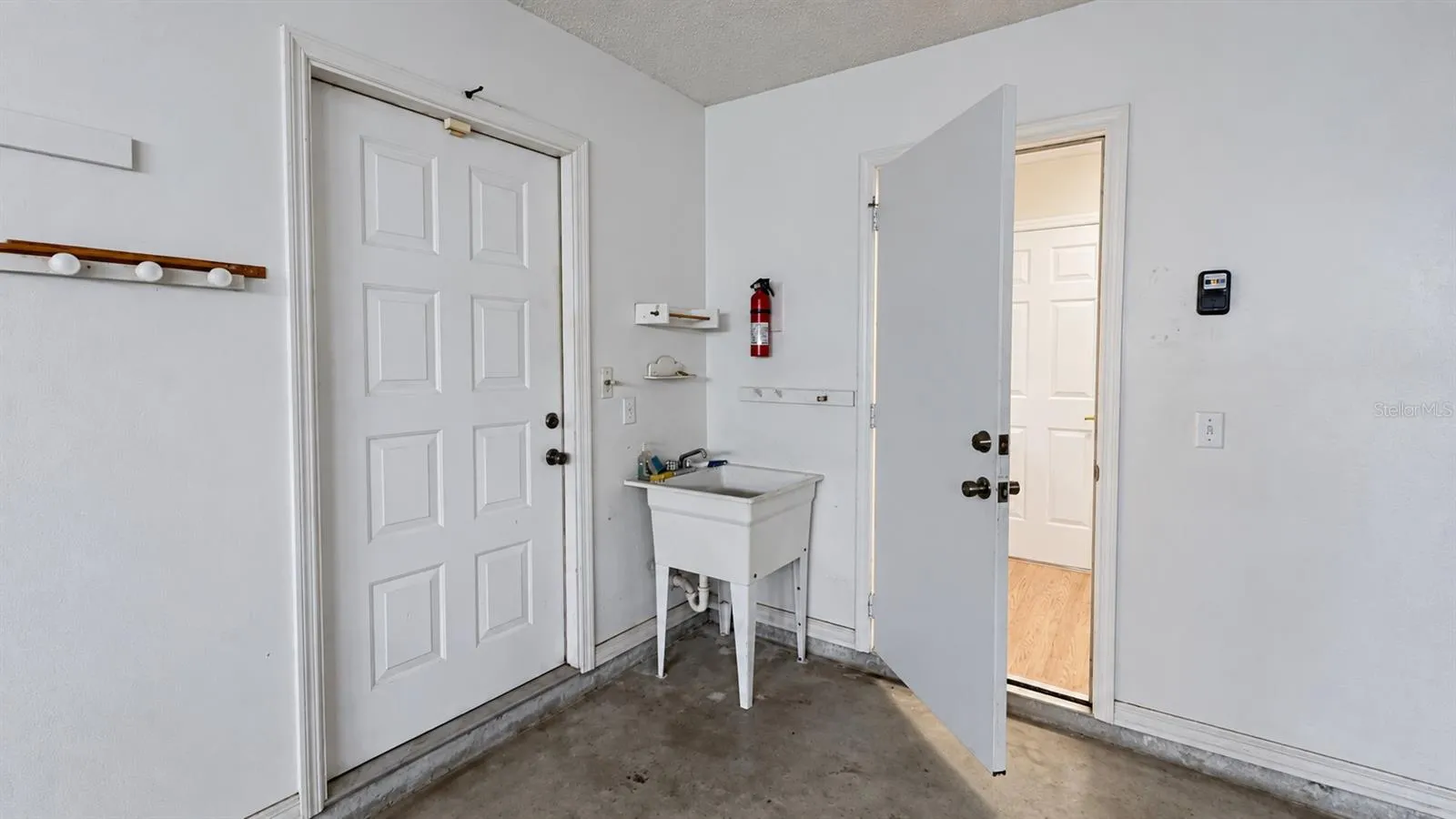 Garage features a handy utility sink.