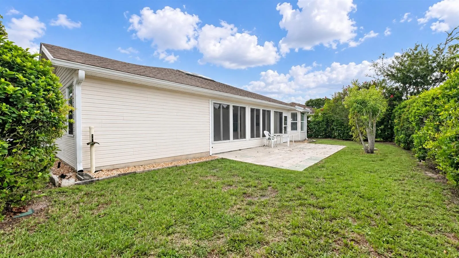 Large back patio with plenty of space to entertain and privacy.