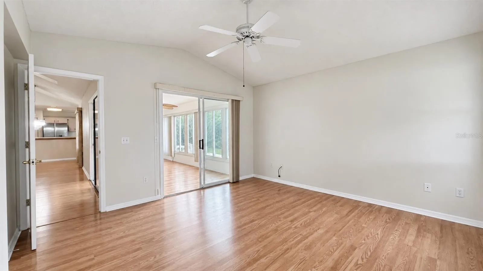 Master bedroom facing the side and lanai features large WIC and bath.