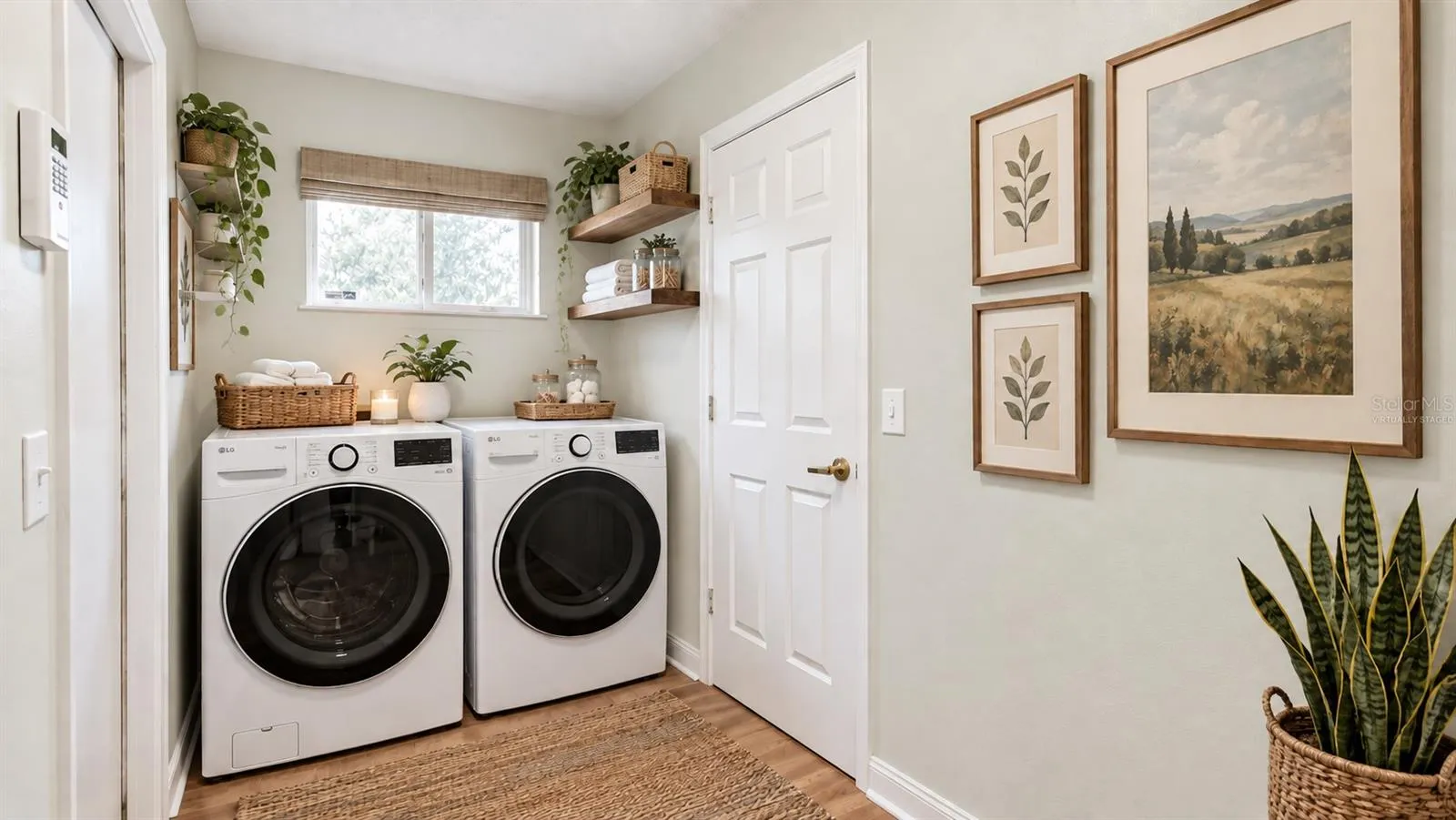 Large laundry room with tons of storage possibilities on the opposite side. Virtually staged.