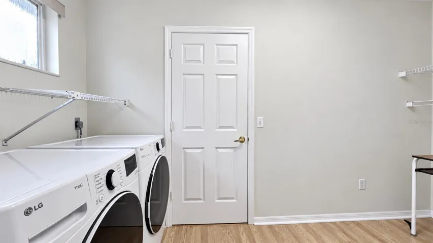 Large laundry room with tons of storage possibilities.
