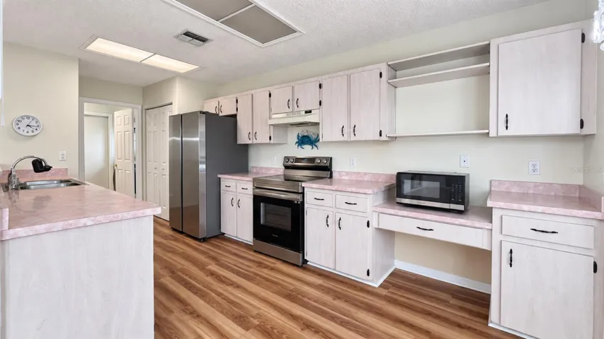 Large kitchen with breakfast room facing the backyard.
