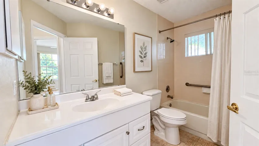 Guest bathroom is spacious. Virtually staged.