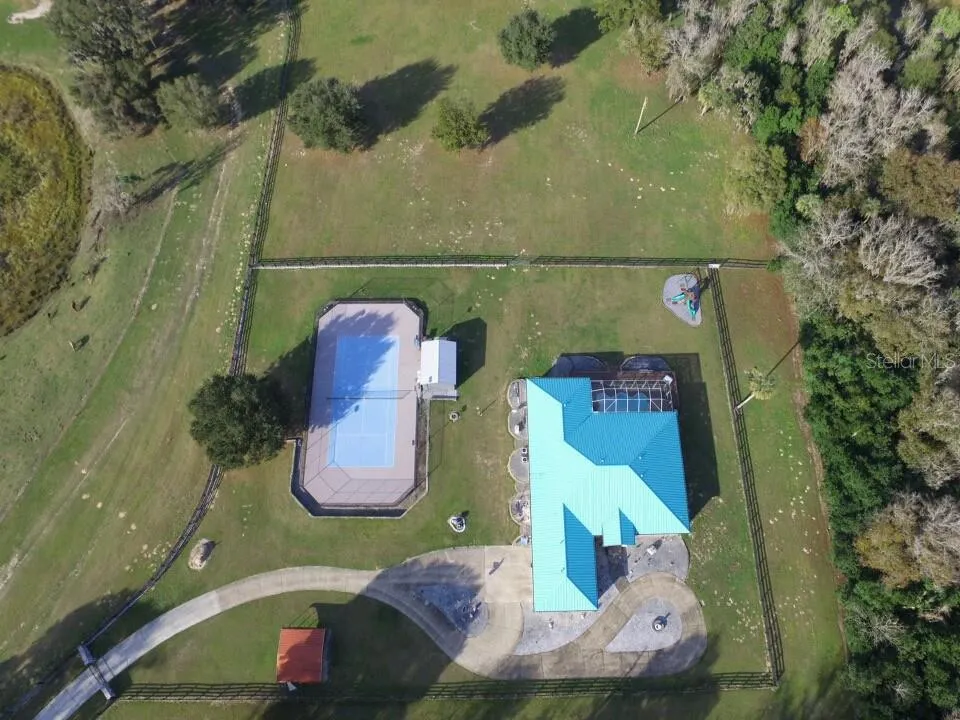 residence and stadium sized tennis court