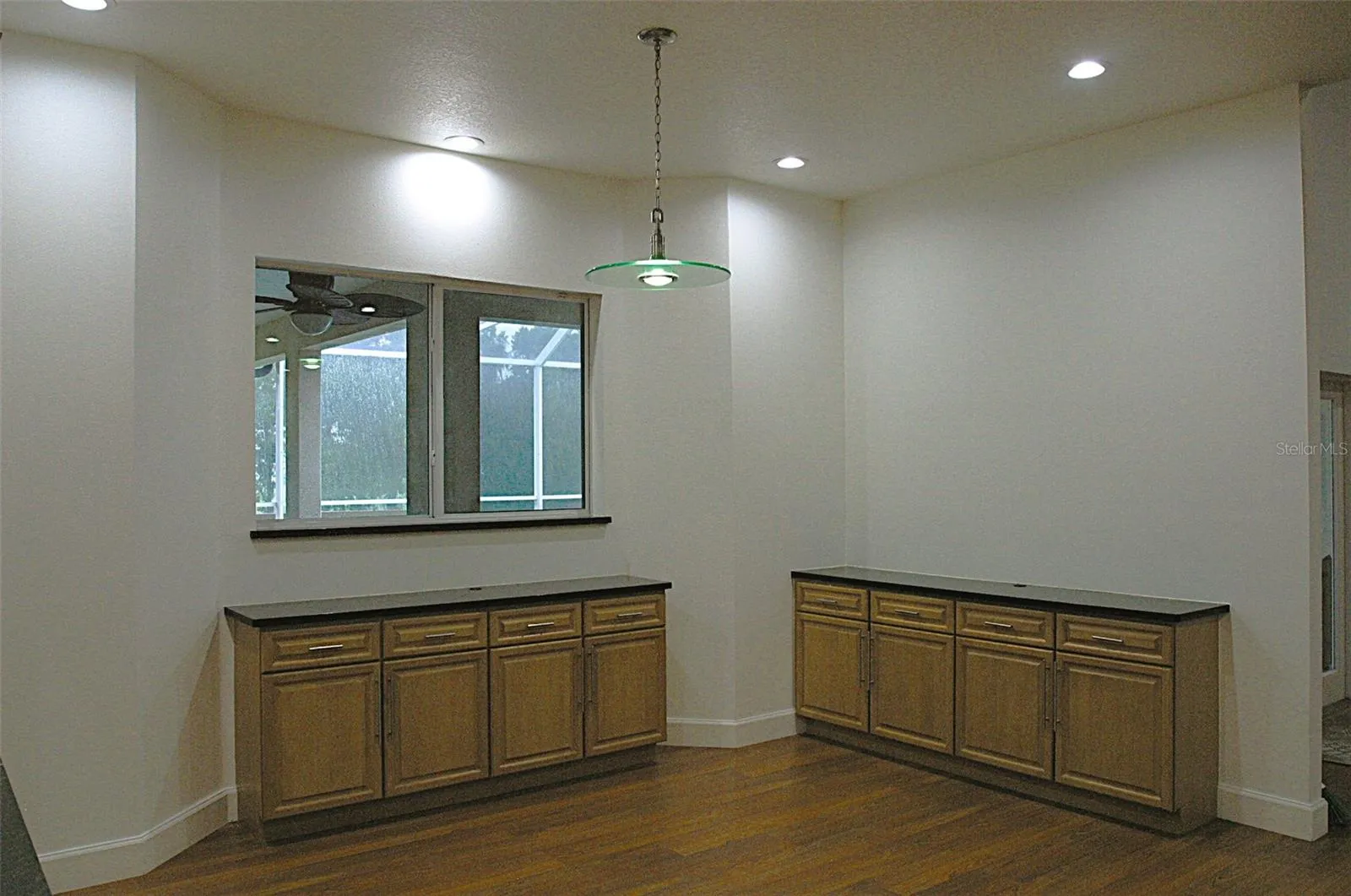 Kitchen window to pool, granite counter tops