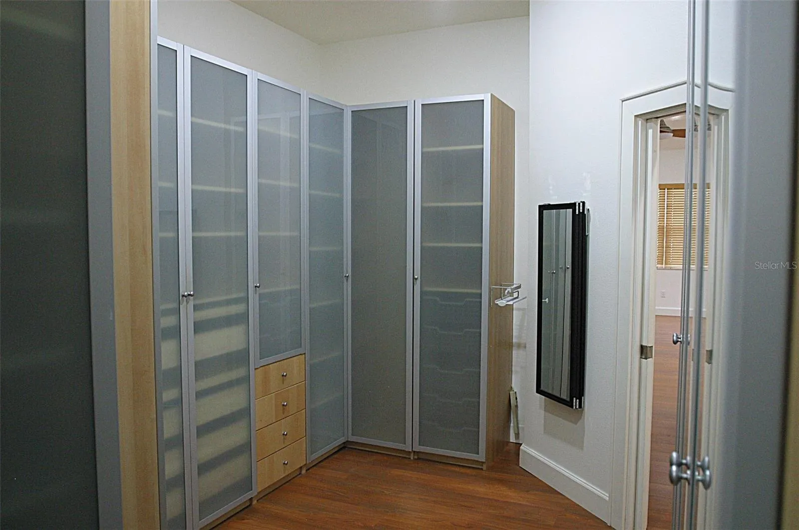 Master HERS closet built in 10' x 10'3" hanging 10 x 10'3