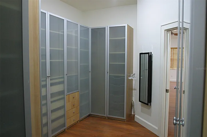 Master HERS closet built in 10' x 10'3" hanging 10 x 10'3