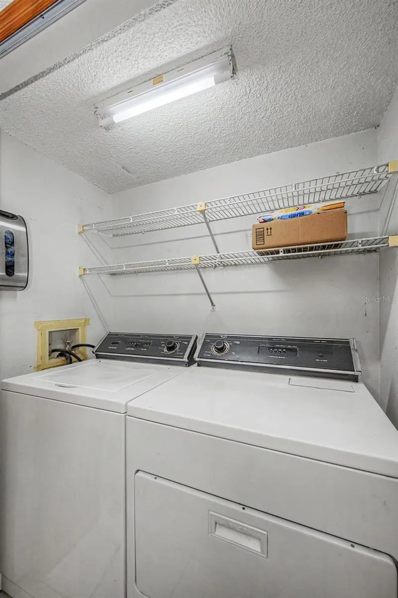 laundry area located near kitchen