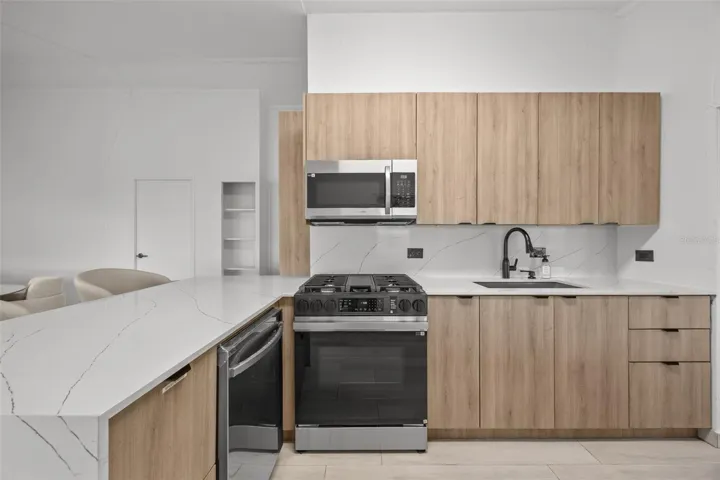Newly Remodeled Kitchen with Quartz Countertops and Brand-New Appliances, Including a Dishwasher- Cayey