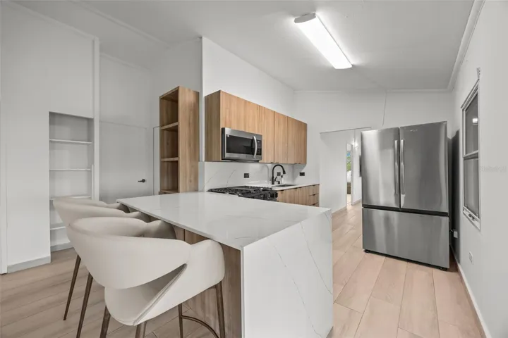 Newly Remodeled Kitchen with Quartz Countertops and Brand-New Stainless Steel Refrigerator- Cayey
