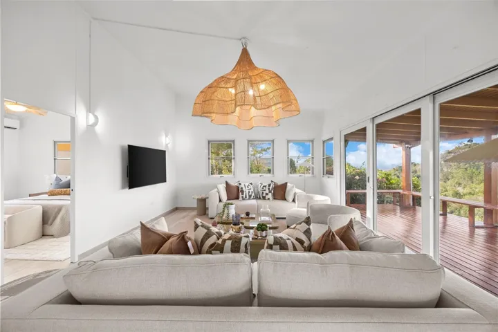 Spacious Living Room with Seamless Connection to the Covered Deck - Cayey