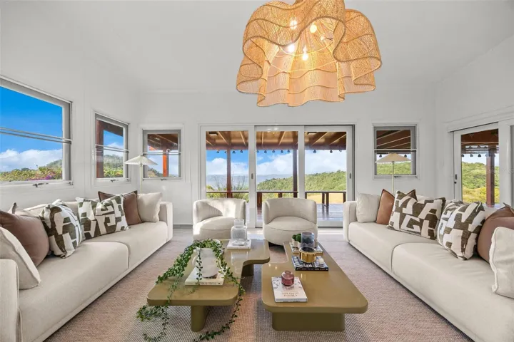 Living Room with Direct Access to the Covered Deck and Spanning Mountain Views - Cayey