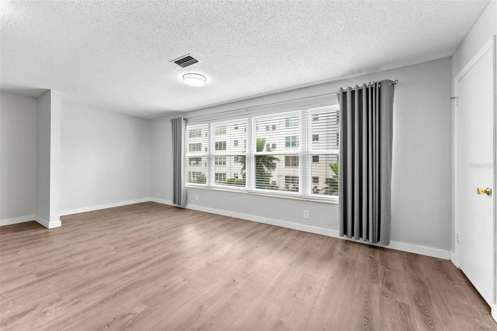 The Florida room has an nice alcove space if you want to put in a Murphy bed for visitors!  Note those wonderful new windows!