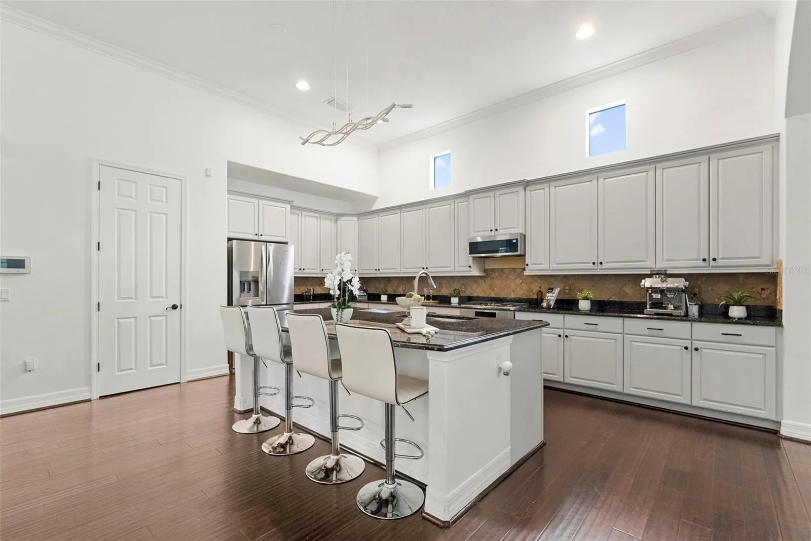 Kitchen-Expansive Island With Bar Seating