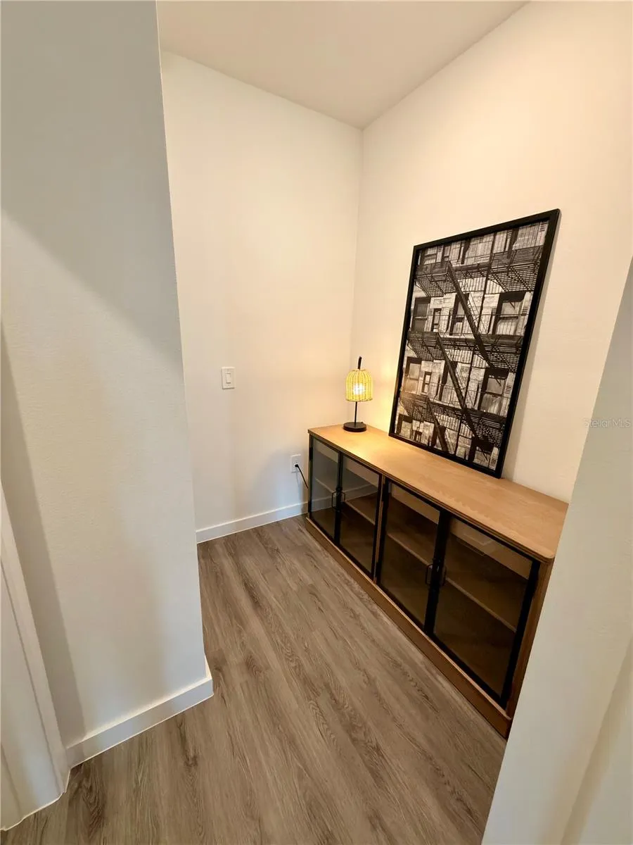Hall to first level bedroom and bath. Could be a good space for a desk/small office