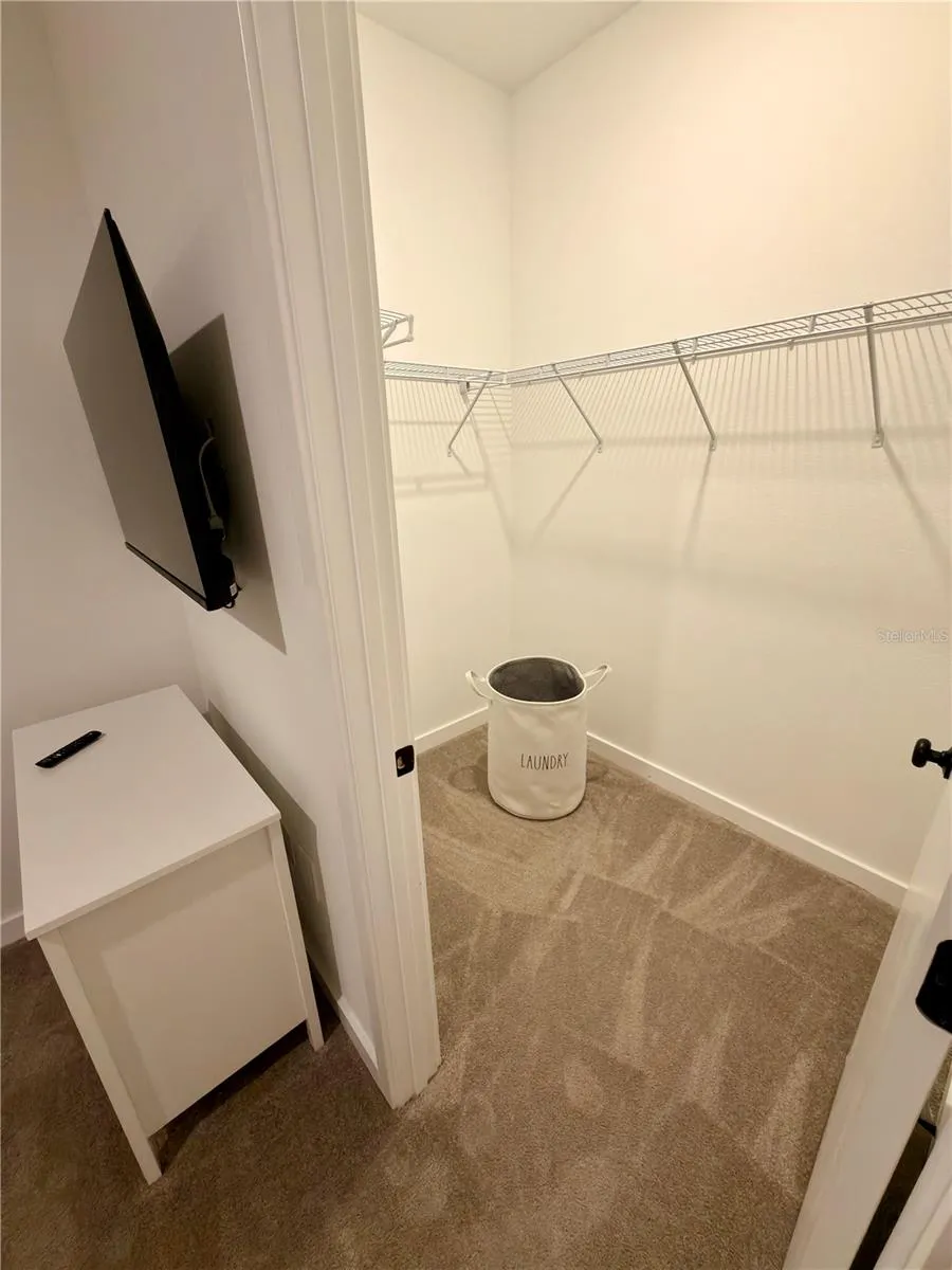 First level bedroom with walk-in closet