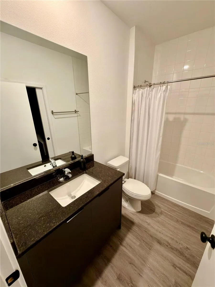 First level bath with a hall access but if locked, becomes a private en-suite
