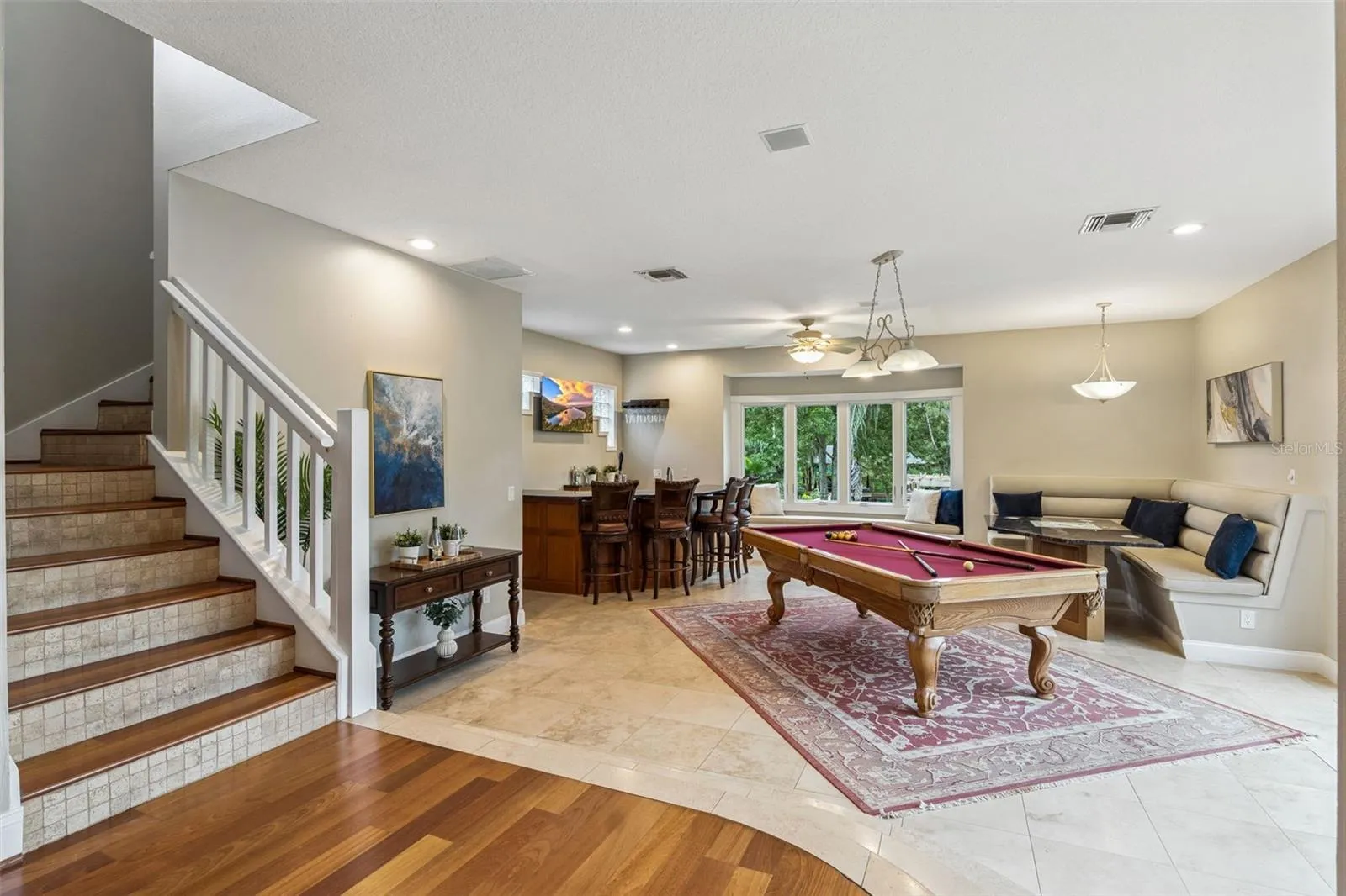 Game room and stairs leading to two bedrooms and one bathroom on 2nd floor