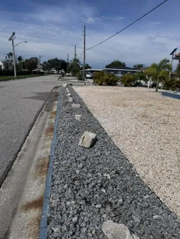 Palms removed on Garage Side to improve traffic visibility