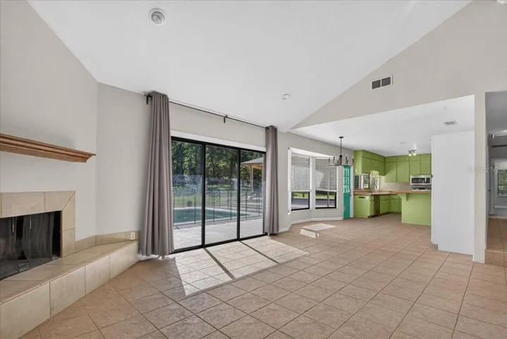 Living Room with sliding door access to the pool