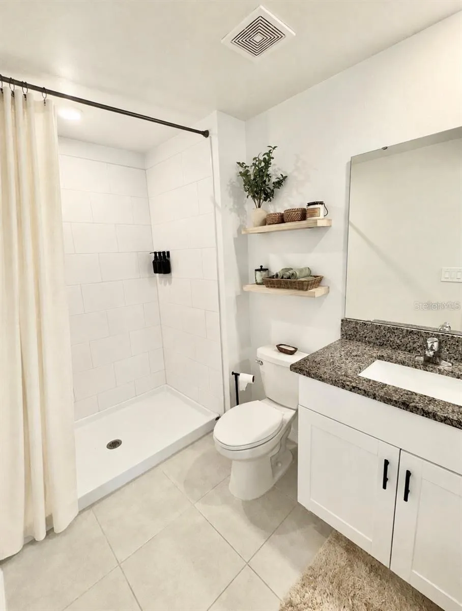Master Bathroom with tiled shower