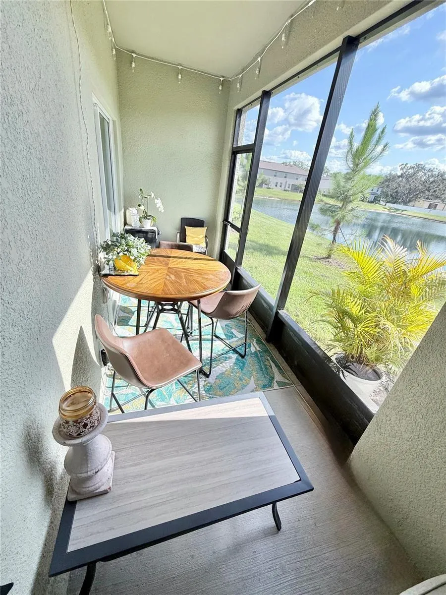 Enclosed screened-in patio overlooking the beautiful large pond