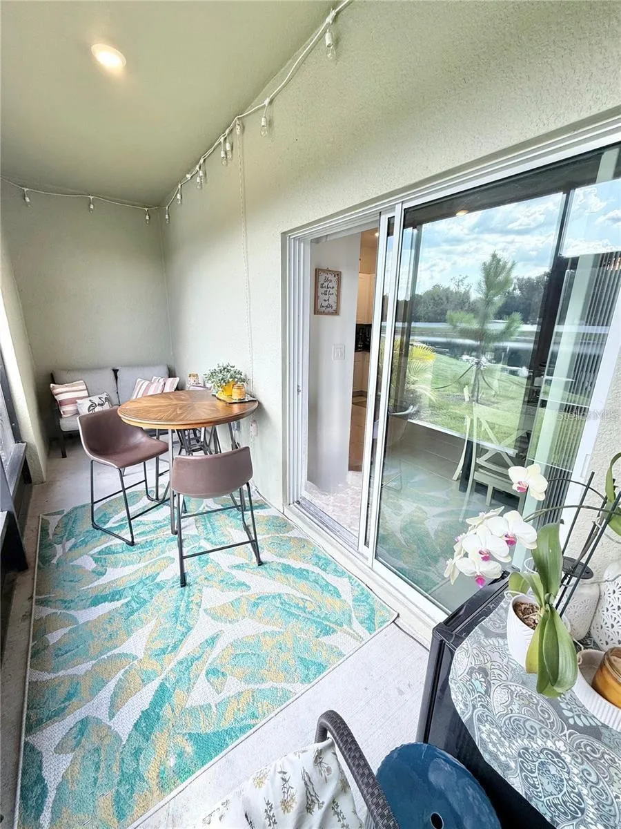 Enclosed screened-in patio overlooking the beautiful large pond