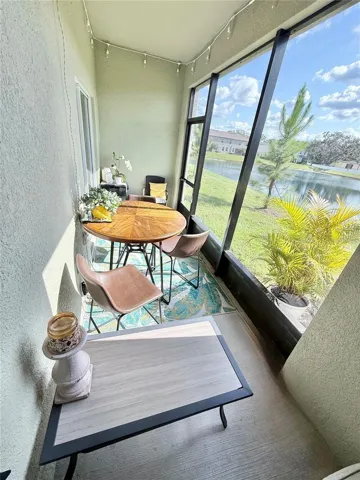 Enclosed screened-in patio overlooking the beautiful large pond