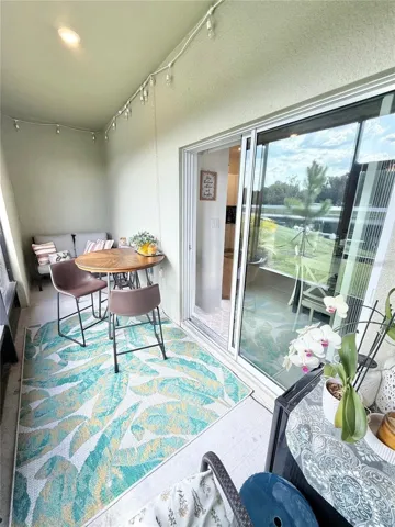 Enclosed screened-in patio overlooking the beautiful large pond